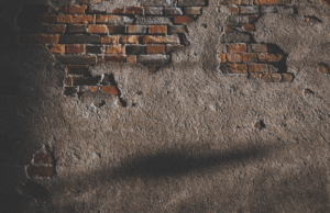 Brick wall with broken bricks